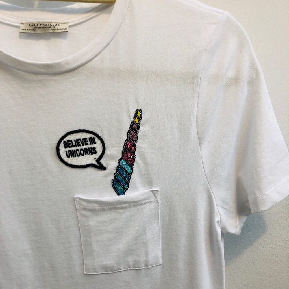White pocket t-shirt with unicorn horn